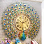 Peacock-themed decorative wall clock with gold and blue accents, ideal for luxury home decor.