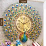 Luxury peacock-themed decorative wall clock with gold and blue accents, ideal for modern home decor.