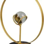 Modern gold decorative sculpture with a circular design and marble base.