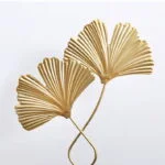 Gold decorative wall art with two fan-shaped leaves, modern home decor accent.
