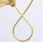 Elegant gold decorative ornament with modern design.