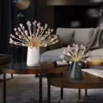 Modern luxury home decor with decorative vases and floral sculptures on coffee tables.