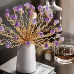Elegant decorative ornament with purple crystals and gold accents on a marble base, modern home decor.