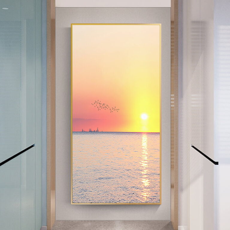 Modern framed wall art with sunset over ocean, enhancing luxury home decor.