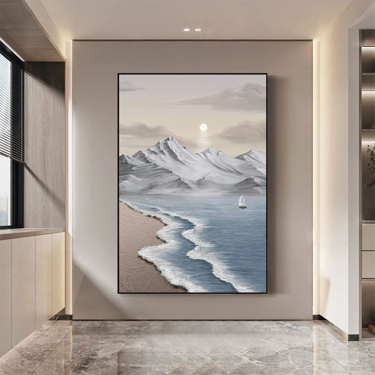 Modern framed wall art of a serene seascape with mountains and a sailboat, enhancing luxury home decor.