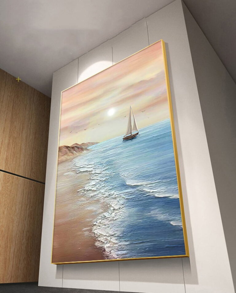 Modern framed wall art of a sailboat on the ocean at sunset, enhancing luxury home decor.