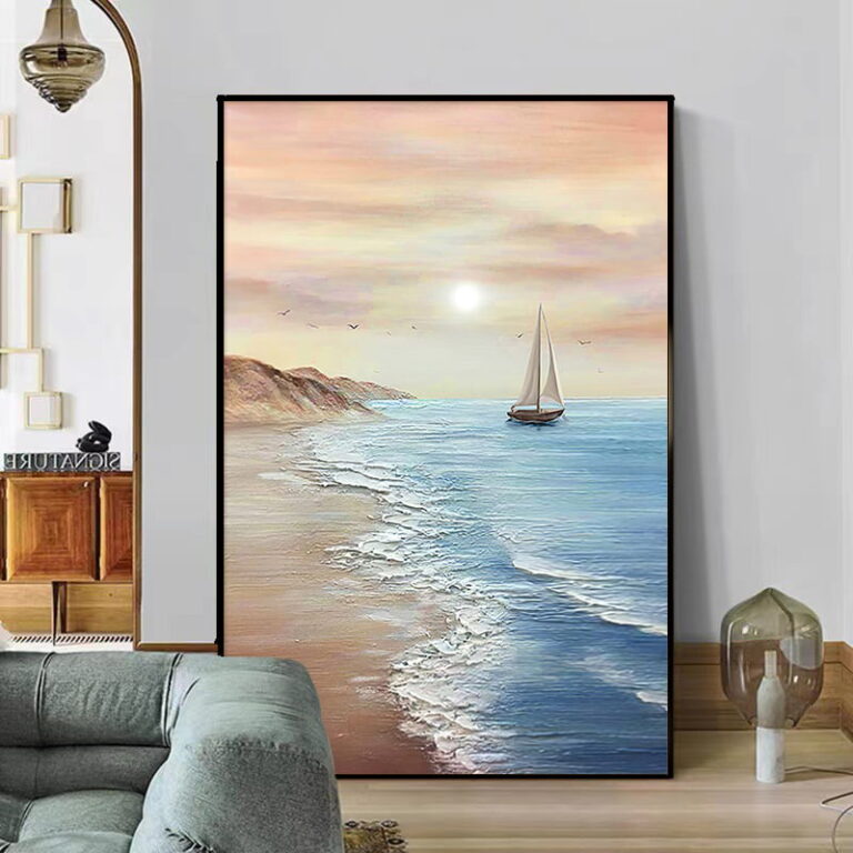 Modern framed wall art of a sailboat on a serene ocean at sunset, enhancing luxury home decor.