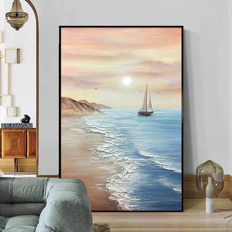 Modern framed wall art of a sailboat on a serene ocean at sunset, enhancing luxury home decor.