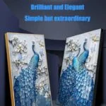Elegant blue peacock wall art with floral accents, framed in gold and black.