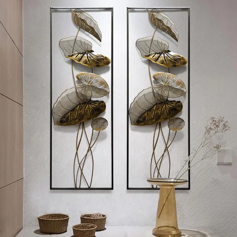 Modern luxury metal wall art with leaf design in a hallway setting.