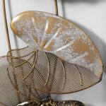 Gold and silver decorative wall art with leaf design for modern home decor.