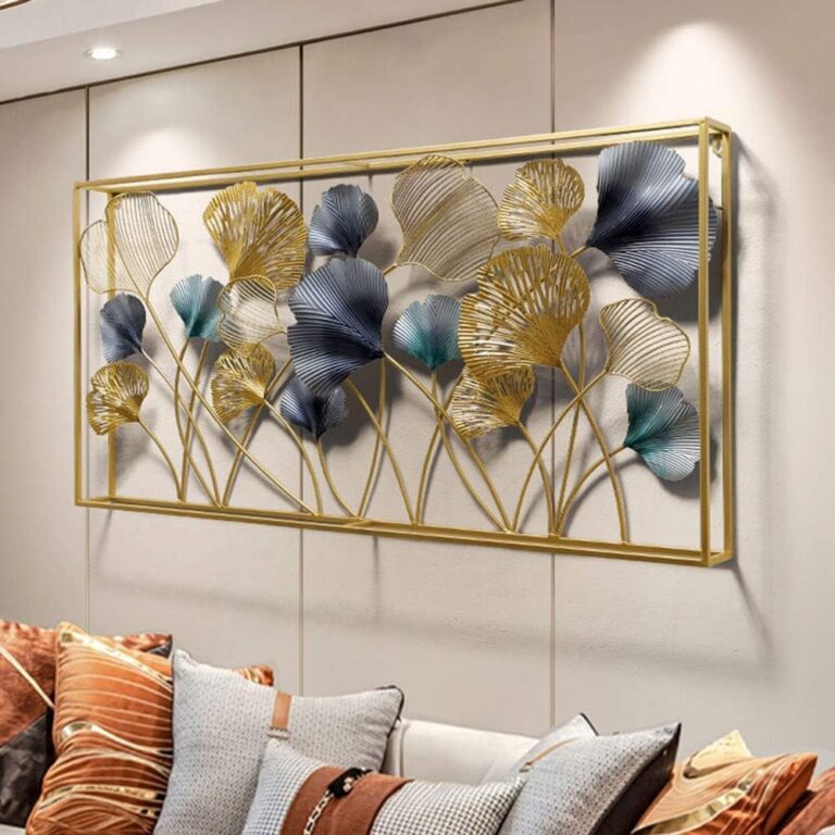 Modern luxury wall art with gold and blue leaf design in a living room setting.