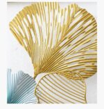 Gold and blue decorative metal wall art with leaf design.