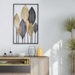 Modern luxury wall art with gold and black leaf design in a living room setting.