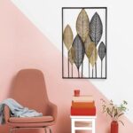 Modern wall art with leaf design in a stylish living room setting.