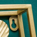 Close-up of a gold aluminum frame for modern wall art.