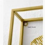 Close-up of a gold aluminium framed wall art with a back hook for hanging.