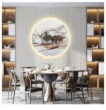 Modern dining room with illuminated circular wall art and luxury decor.