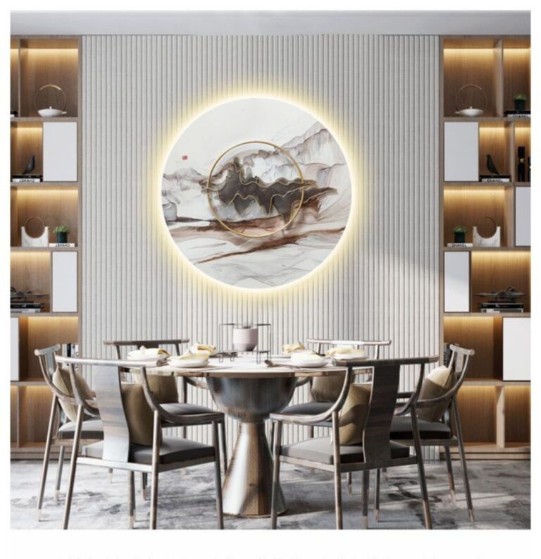 Modern dining room with illuminated circular wall art and luxury decor.