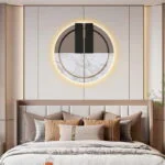 Modern illuminated wall art above a bed in a luxury bedroom setting.