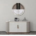 Modern wall art above a decorative cabinet with geometric design in a luxury home setting.