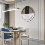 Modern dining room with circular marble and metal wall art, wooden table, and blue chairs.