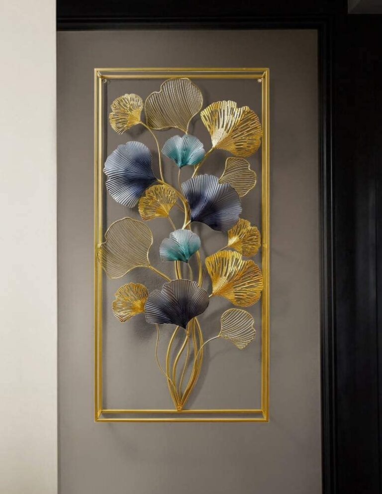 Modern gold and blue metal wall art with floral design in a rectangular frame.