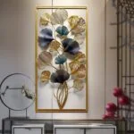 Modern luxury metal wall art with floral design in gold and blue tones, framed and displayed in a stylish interior.