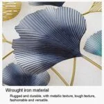 Metal wall art with leaf design in blue and gold tones, modern home decor.