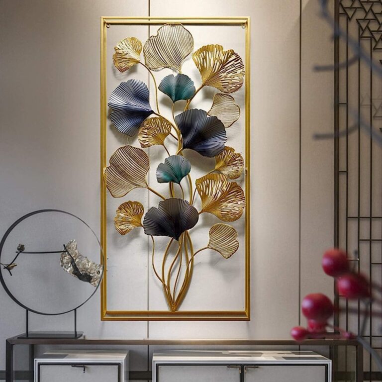 Modern luxury metal wall art with floral design in gold and blue tones, framed and displayed in a stylish interior.