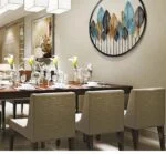 Modern dining room with decorative wall art and elegant table setting.