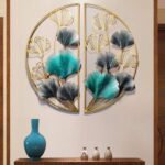 Modern metal wall art with floral design in gold and teal, enhancing luxury home decor.