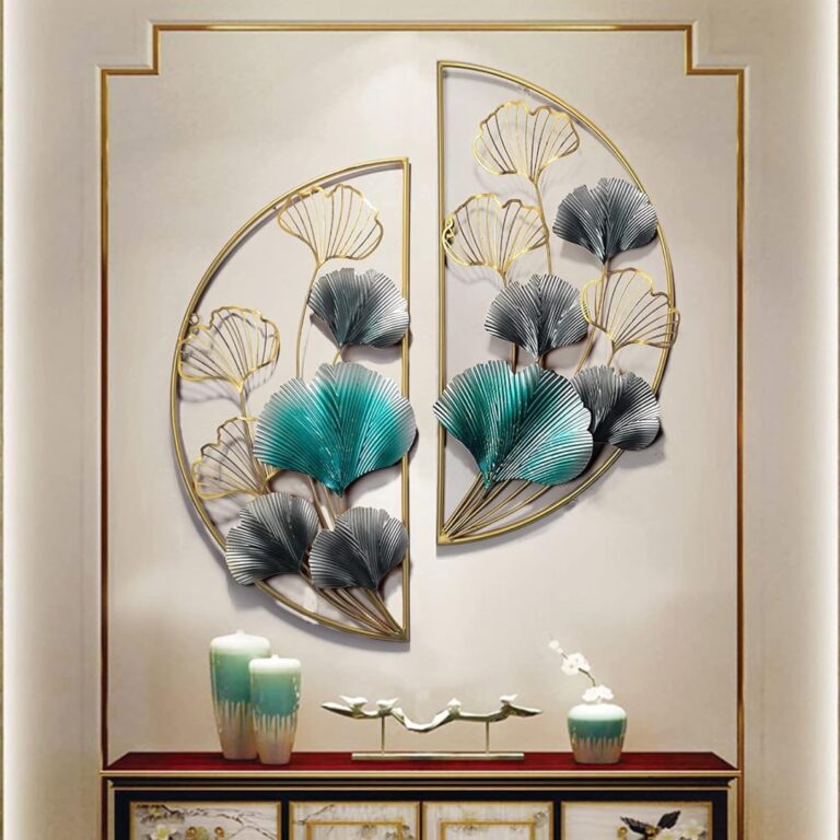 Modern metal wall art with floral design in gold and teal, above a decorative console with vases.