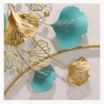 Modern gold and teal metal wall art with leaf design, perfect for luxury home decor.