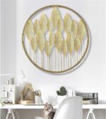 Gold leaf metal wall art in modern home office setting.