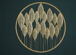 Gold metal wall art with leaf design in a circular frame, modern home decor.