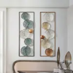 Modern framed wall art with geometric patterns in a luxury home setting.