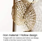 Iron wall art with hollow design, adding luxury to home decor.