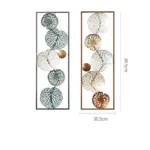 Modern decorative wall art with intricate circular designs in metal frames.