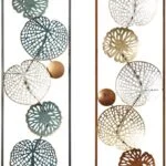 Modern metal wall art with abstract leaf designs in black and gold frames.