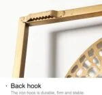 Close-up of a gold wall art frame with a durable back hook.