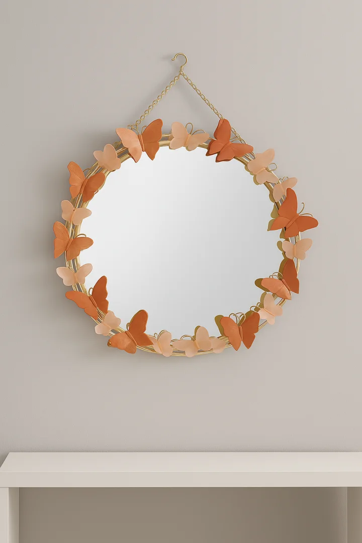Round decorative wall mirror with butterfly accents, ideal for modern home decor.