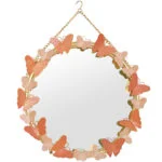 Round decorative mirror with butterfly accents, ideal for modern home decor.