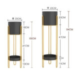Set of two modern gold and black indoor planters with dimensions.