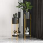 Modern gold and black indoor planters with plants in a stylish home setting.