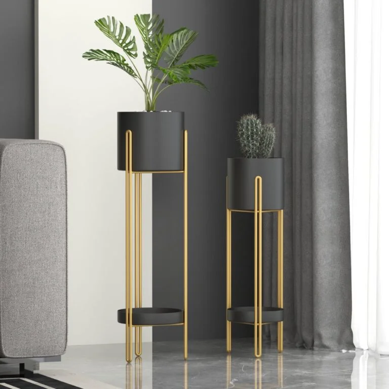 Modern gold and black indoor planters with plants in a stylish living room setting.
