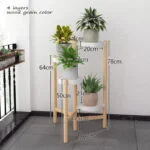 Modern wooden plant stand with four layers and potted plants, ideal for home decor.
