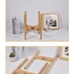Bamboo plant stand with books and framed art on a shelf.