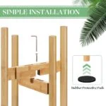 Bamboo plant stand with simple installation guide and rubber protective pads.