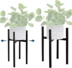 Adjustable black metal plant stand with decorative planter.
